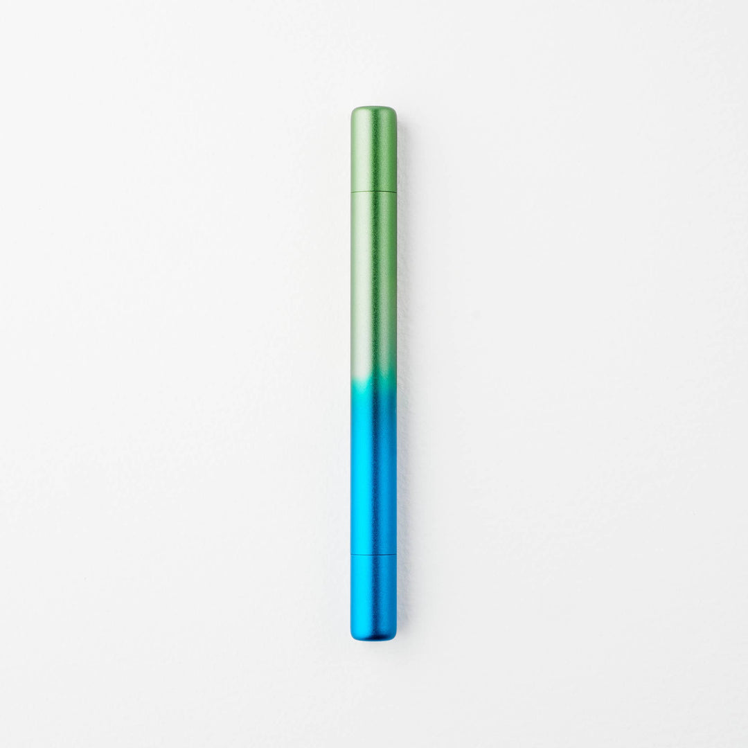 Gradient blue to green pen with caps on either end.