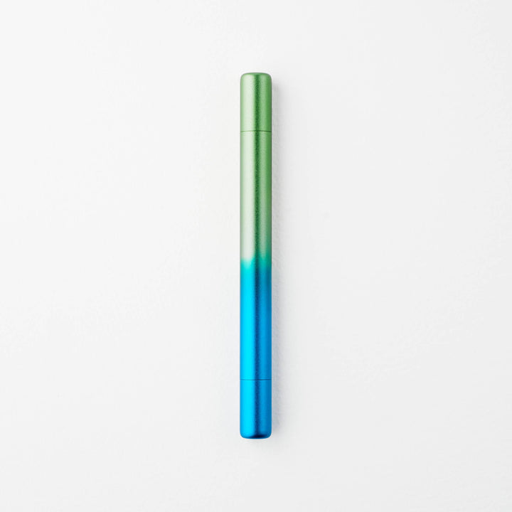 Gradient blue to green pen with caps on either end.