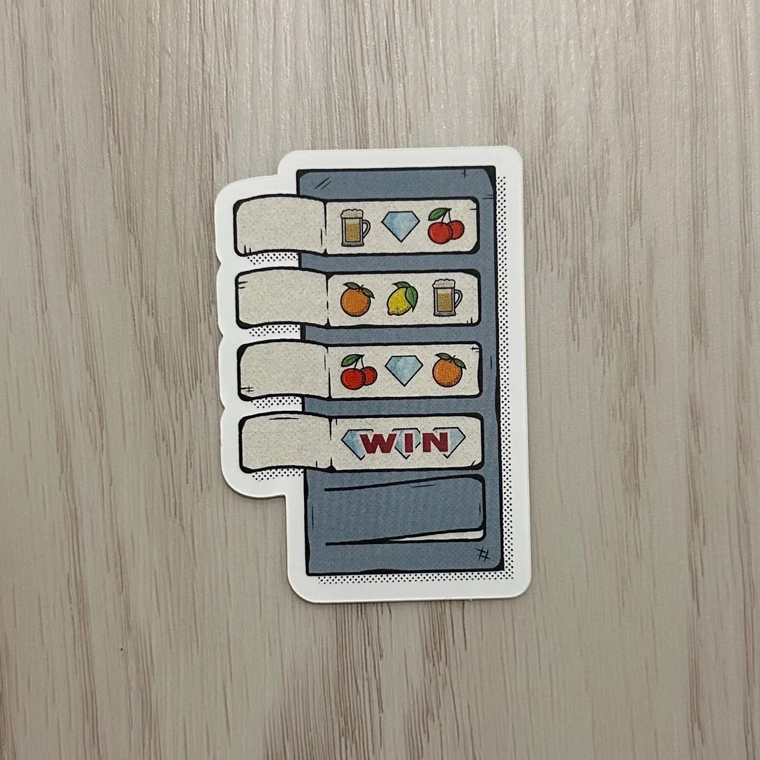 Sticker with an illustration of a retro slot machine with various fruit and gem icons.