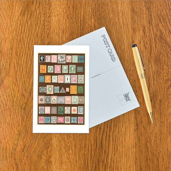 Front and back of postcard next to a pen.