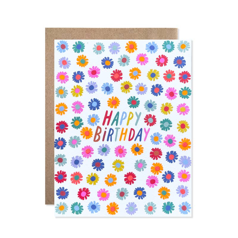 Hand-drawn daisy-like flower heads in multiple colors surrounding text in the same array of colors.