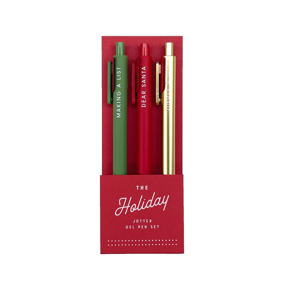 Green, red, and gold pens in a red sleeve titled The Holiday Jotter Gel Pen Set