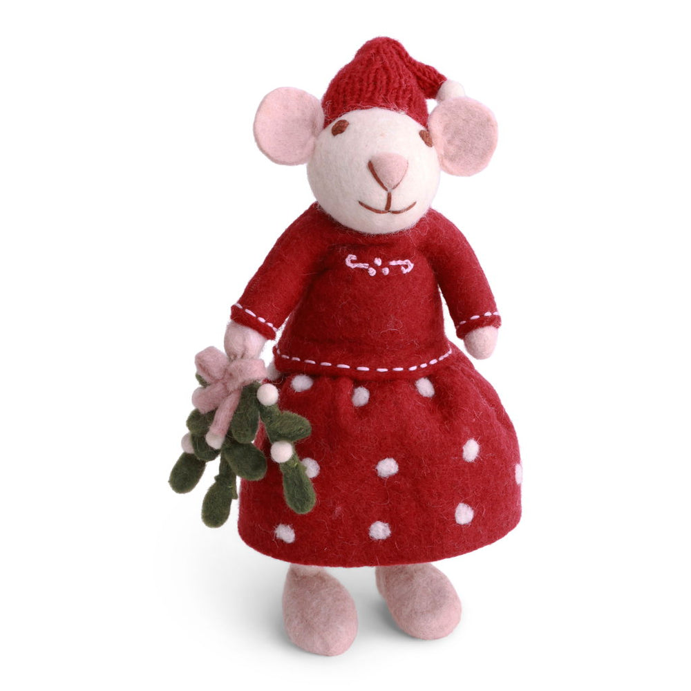 A handcrafted felted wool mouse wearing a red dress with white polka dots and a matching red Santa hat, holding mistletoe.