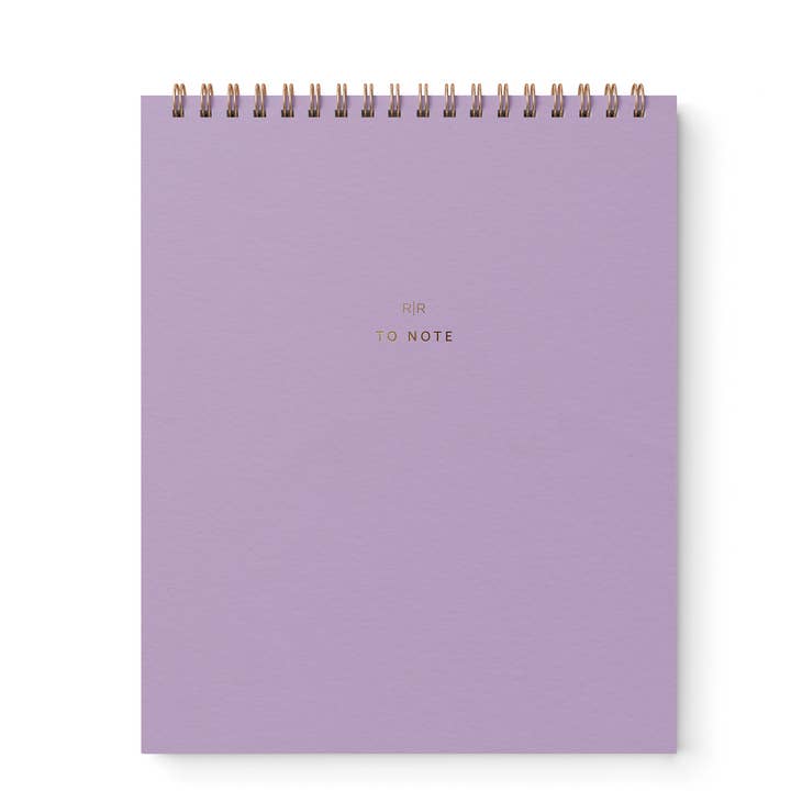 Cover of notebook in lavender with gold wire binding at top.