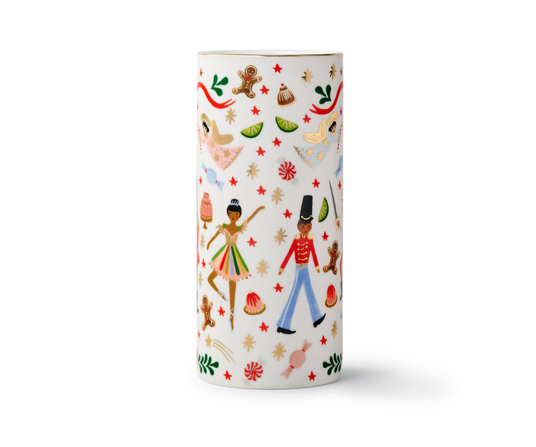 Opposite side of cylindrical vase with Nutcracker and Christmas illustrations on an off-white background.