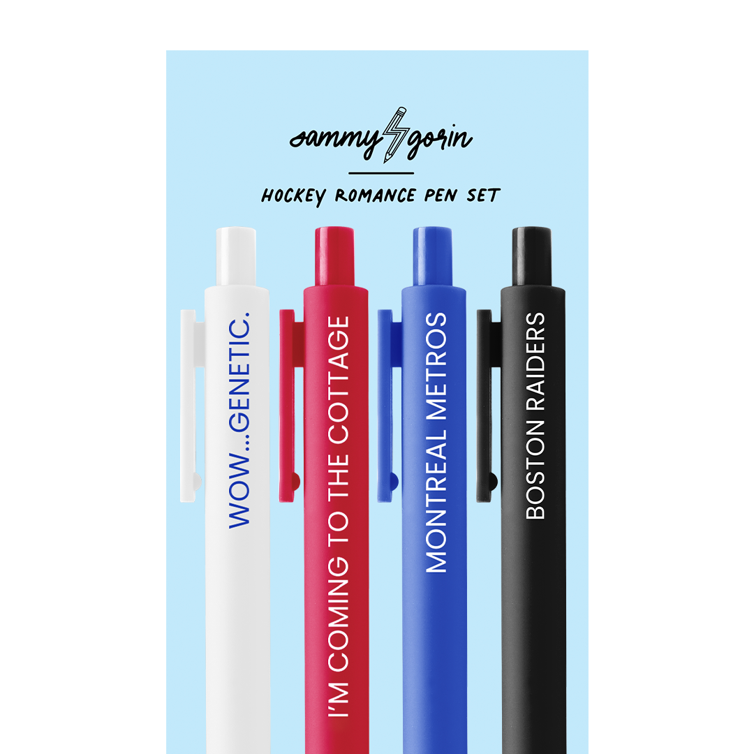 Four pens on a blue cardboard backing. The pen colors are white, cherry red, purple, and brown, each with white text.