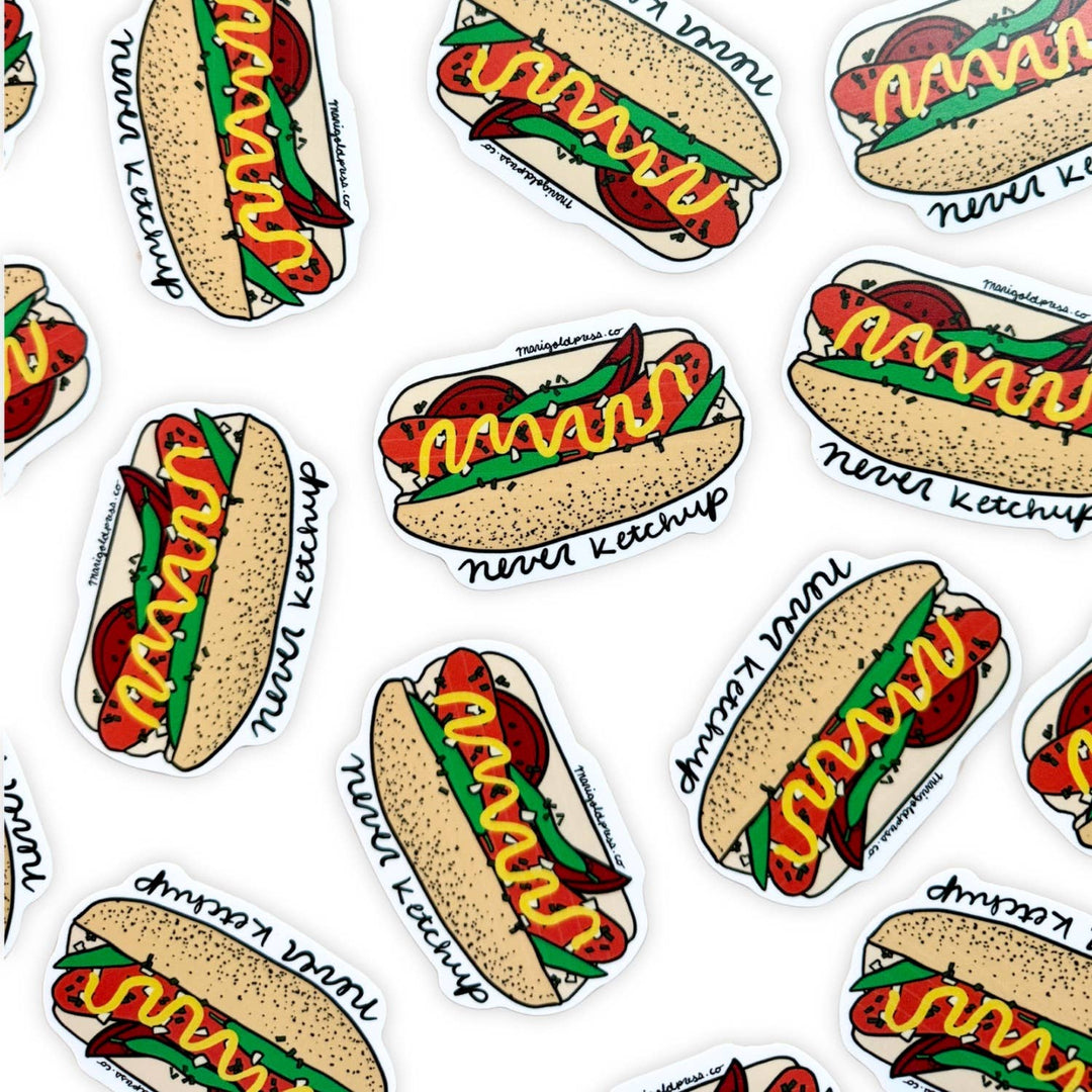 Several stickers of a hot dog with mustard and other additions above the words 'never ketchup.' 