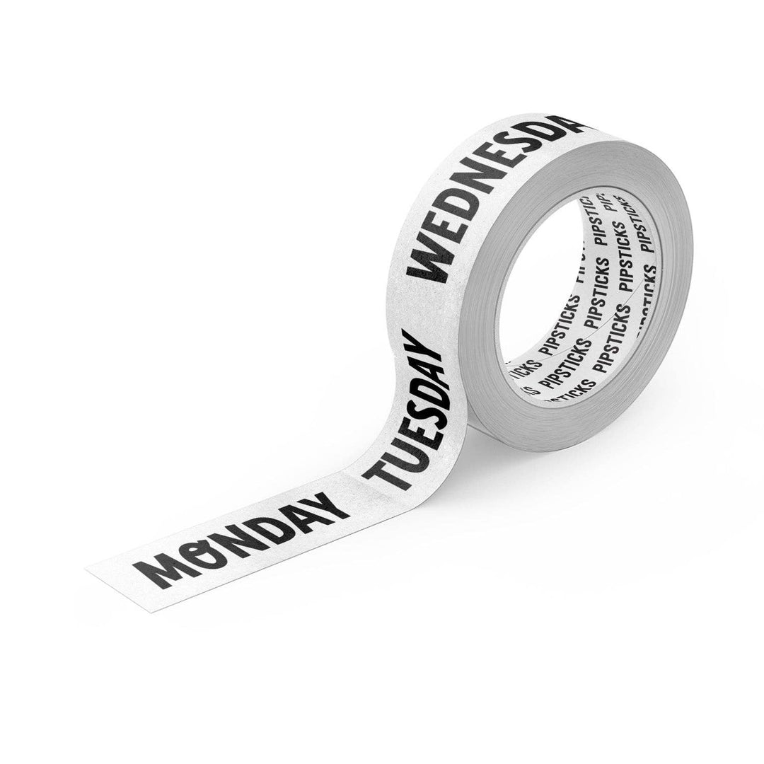 Roll of tape with days of the week printed on it against a white background