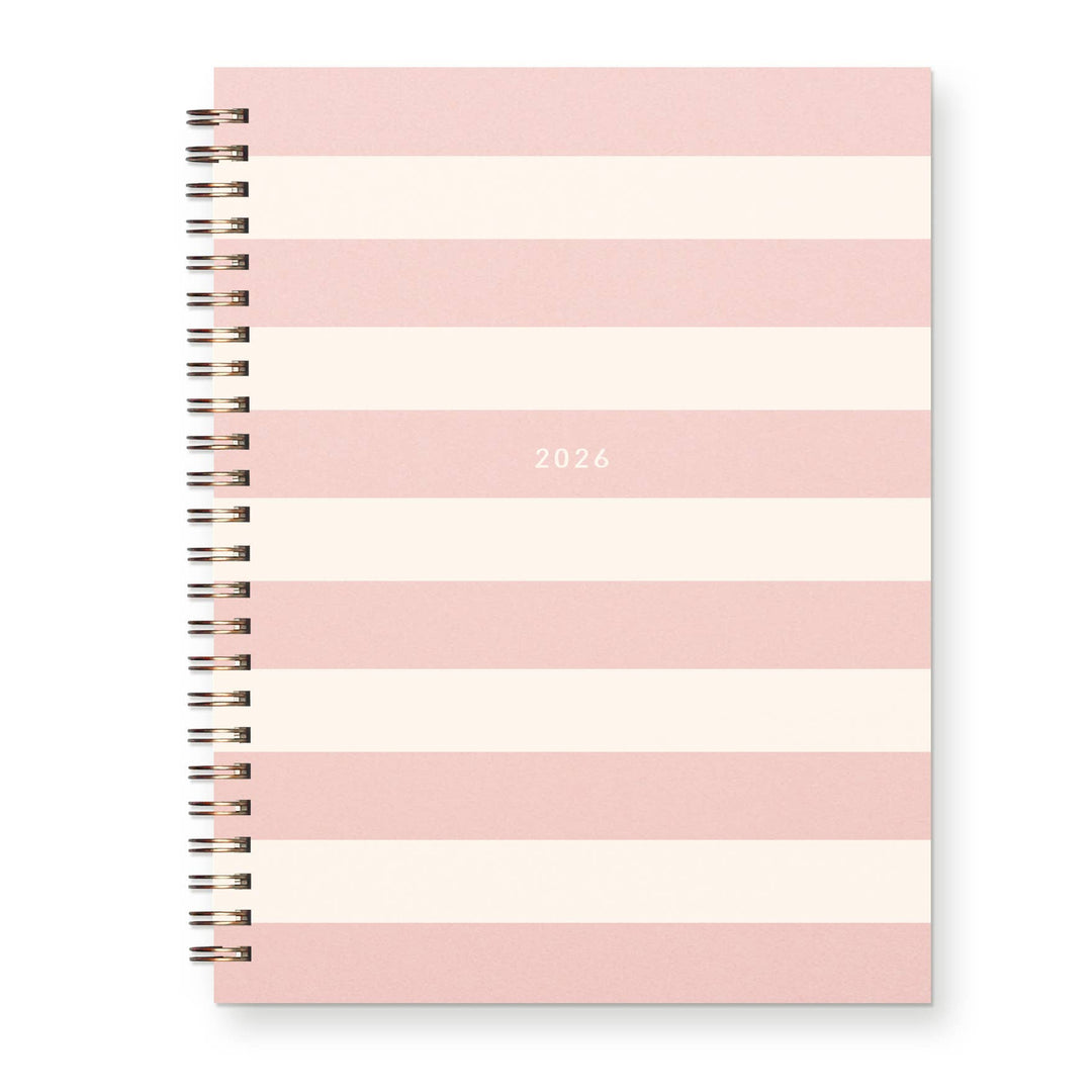 Pink and white striped planner cover with '2026' printed one one of the pink stripes Wire-O binding on the left.