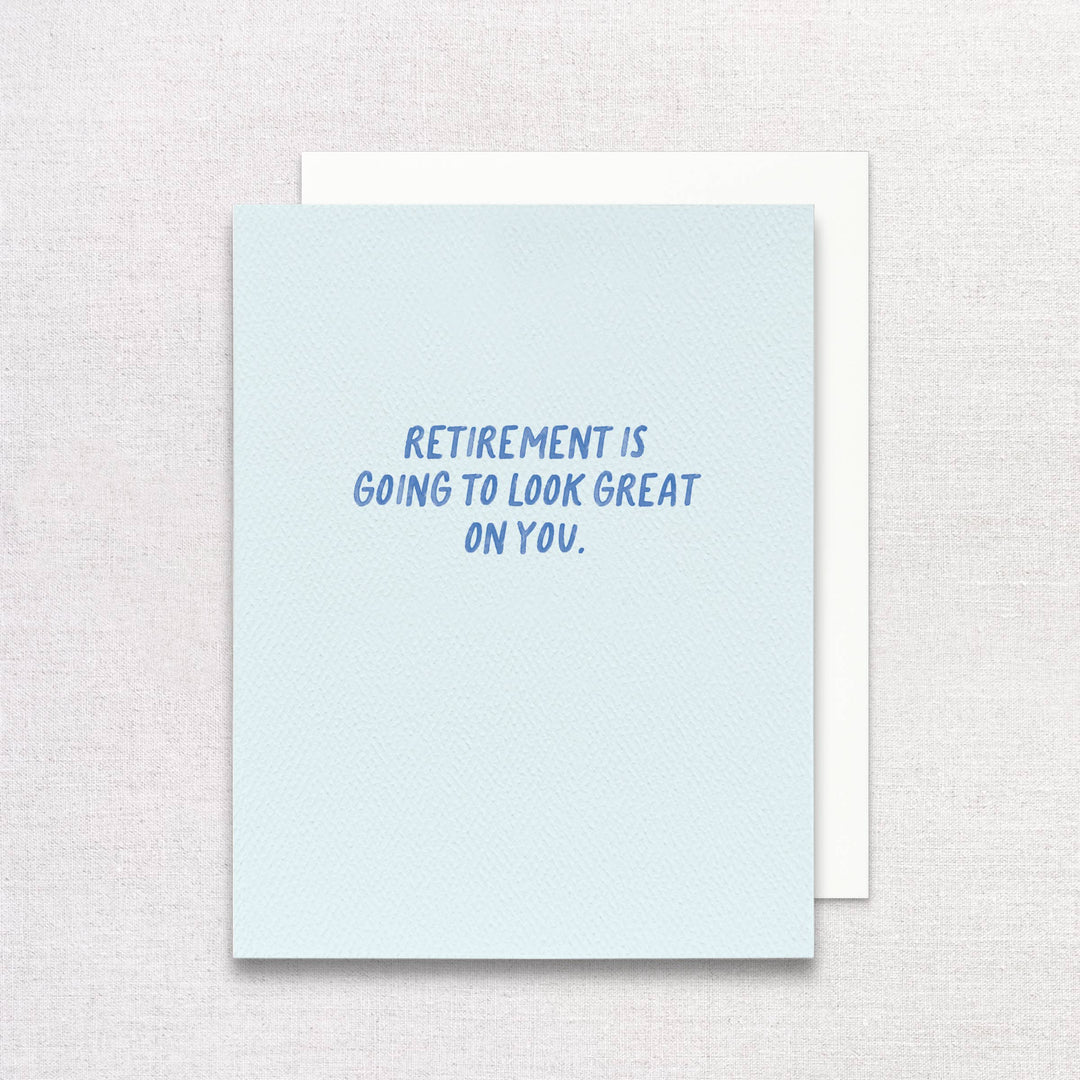 Front of card with blue text on a light blue background and a white envelope.