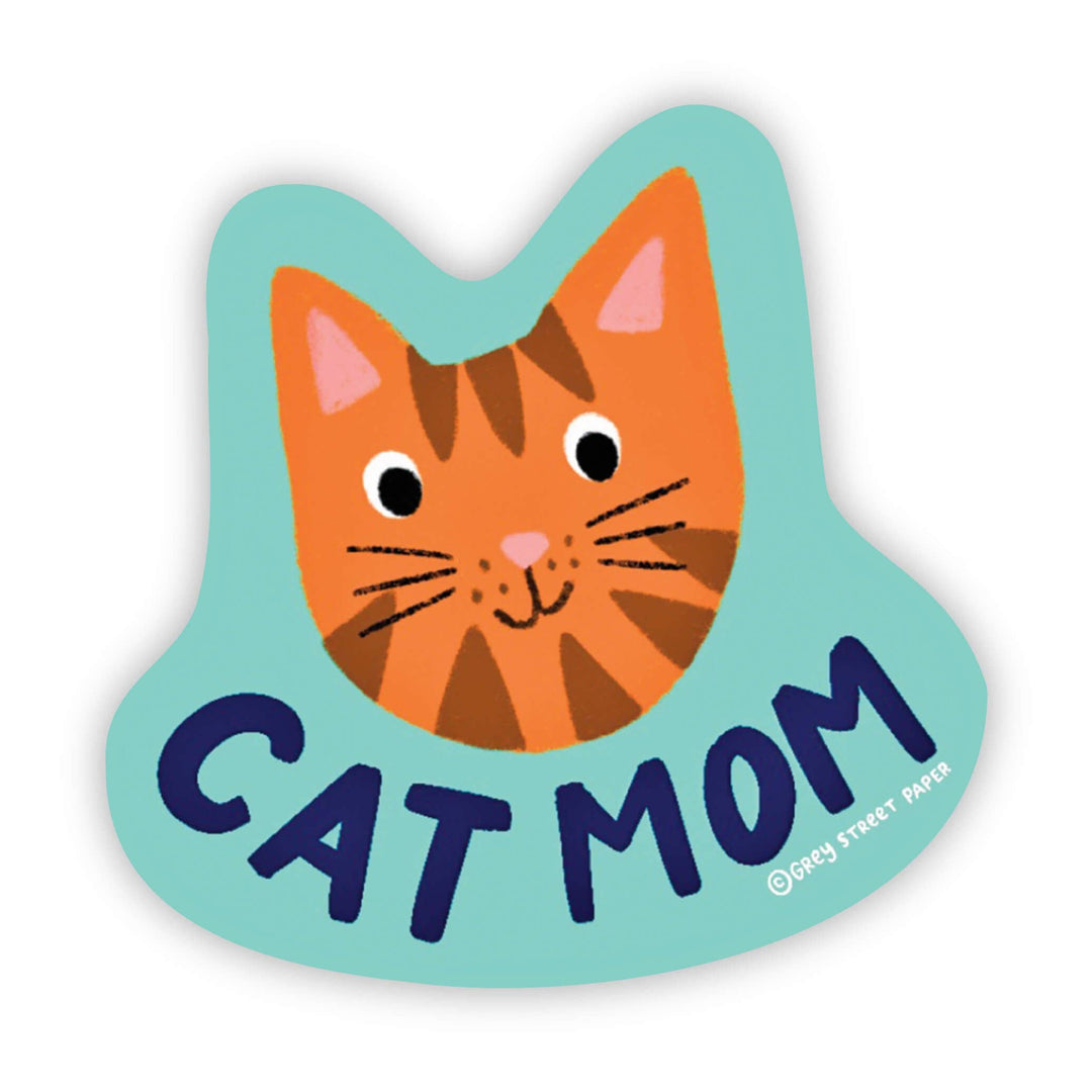 Irregularly-shaped sticker with the head of an orange and brown cat over the text 'cat mom.'