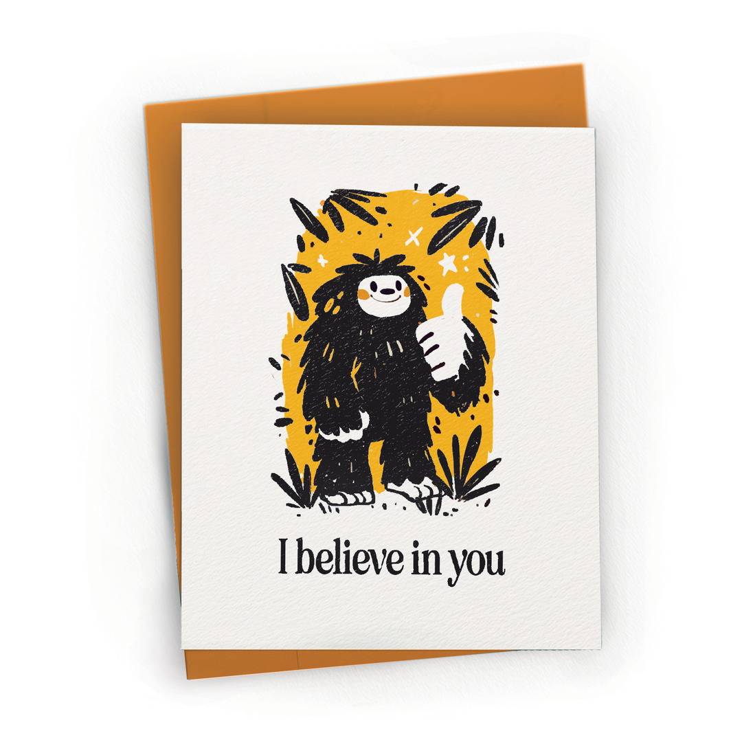 Greeting card with a cartoon yeti illustration and 'I believe in you' text on a white background.