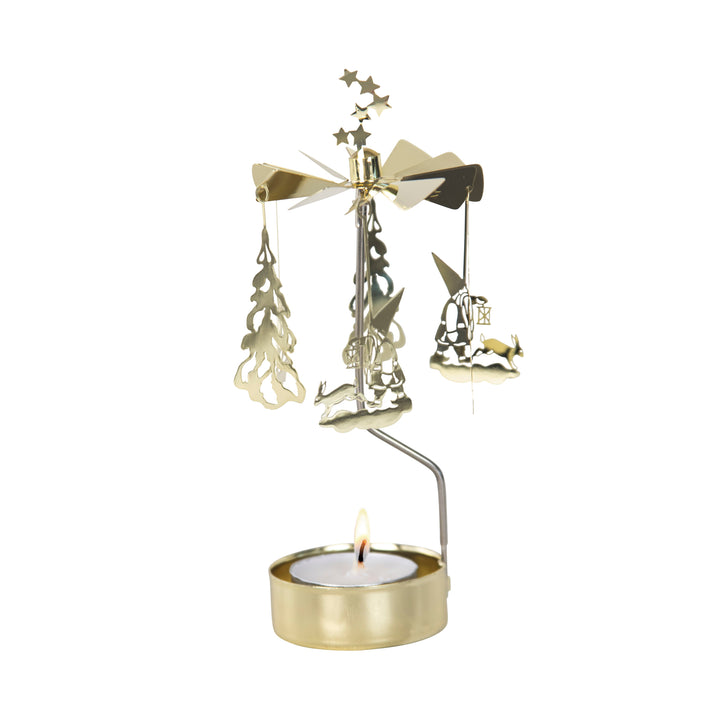 Tea light in a gold holder with vertical arm supporting a carousel of three Santas and three Christmas trees.