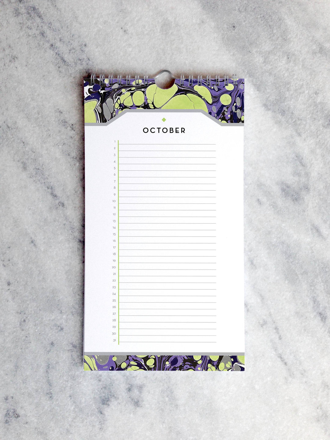 Page for October with marbled paper in shades of green and purple at the top and bottom. Below the month title is a line for each day of the month.