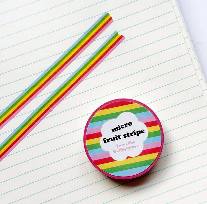 Colorful striped product on lined paper with straws