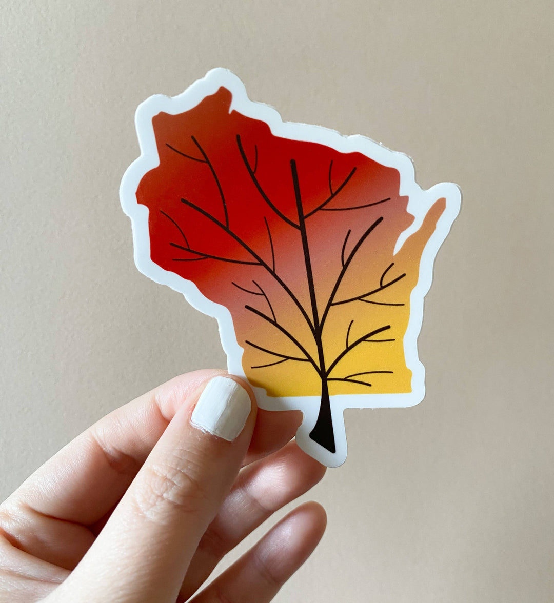 Leafless tree superimposed on the state of Wisconsin, with a gradient of fall colors. 