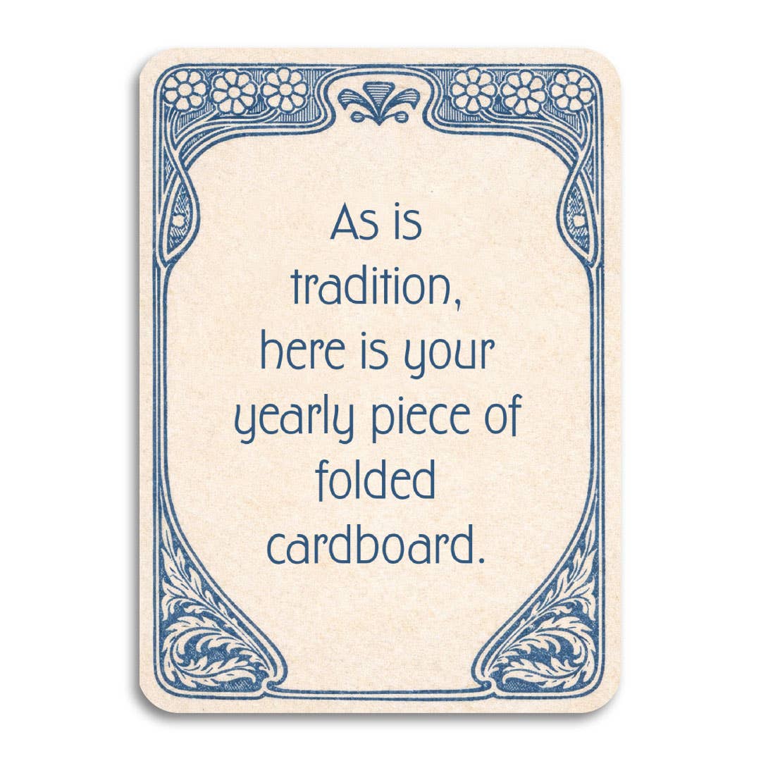 A rectangular cream-colored greeting card with rounded corners, featuring a blue Art Nouveau border and the text, 'As is tradition, here is your yearly piece of folded cardboard.' 