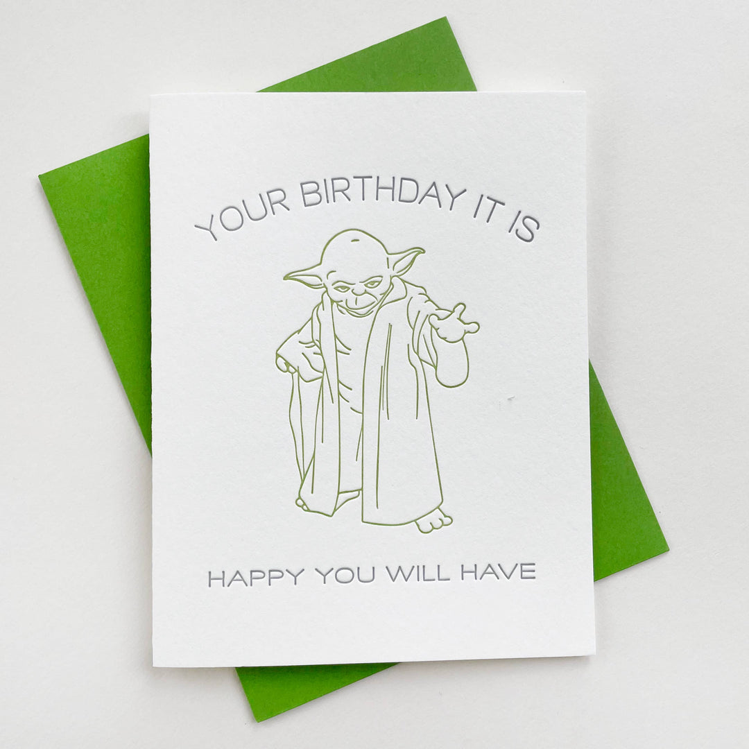 Drawing of Yoda in the center with text above and below.