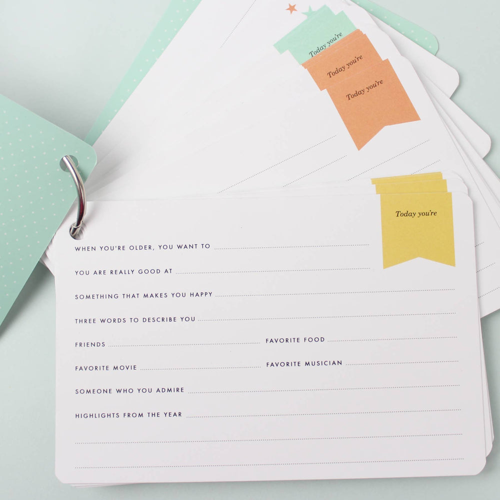 New baby journal with colorful page labels.