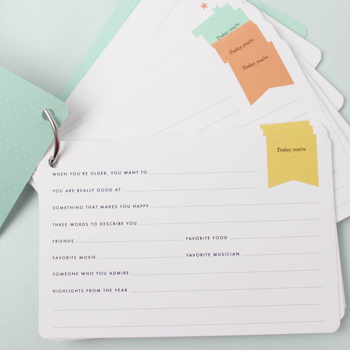 New baby journal with colorful page labels.