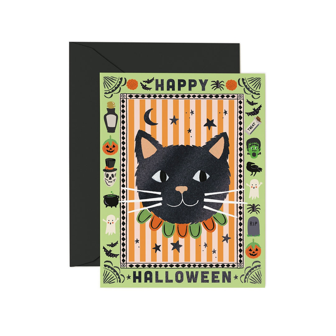 Front of card with large black cat head and  a border of Halloween imagery, with a black envelope.