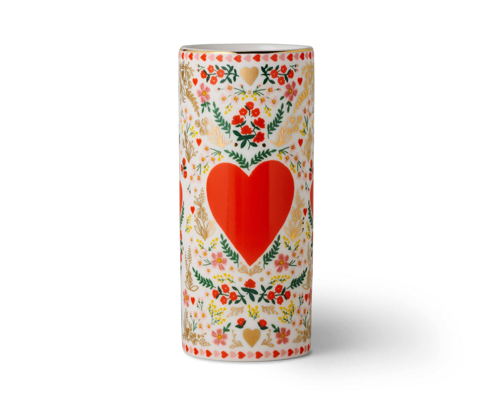 Decorative vase with a red heart and floral patterns.