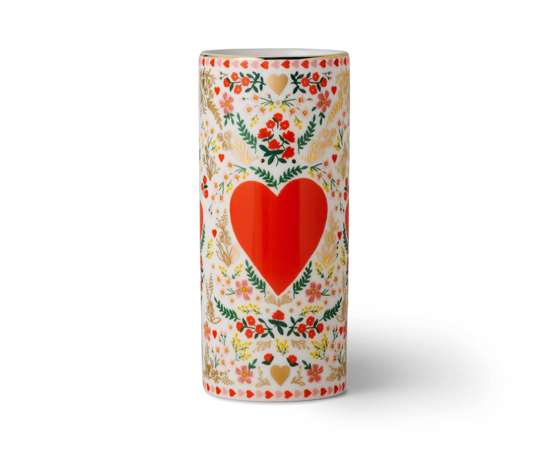 Decorative vase with a red heart and floral patterns.