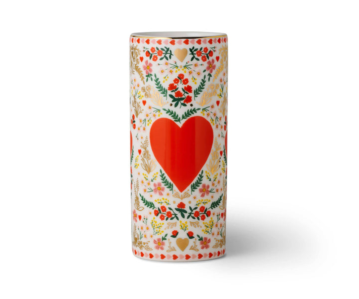 Decorative vase with a red heart and floral patterns.