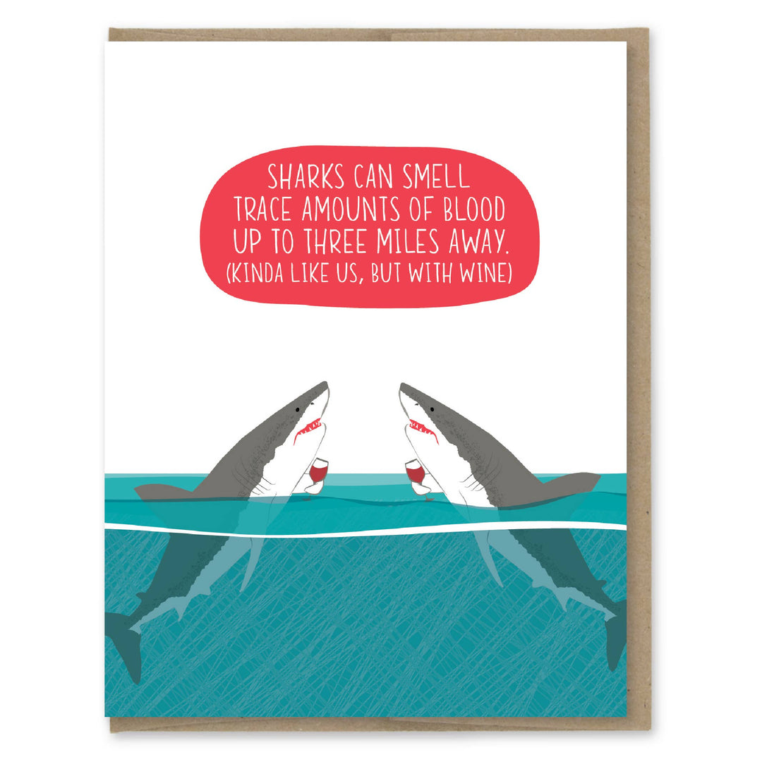 Two sharks in the ocean holding wine glasses. White text in a red oval above them.