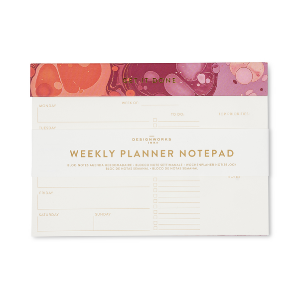 A weekly planner notepad featuring a cream-colored page with gold lettering and lined sections for daily planning, with a orange and red marbled header band.