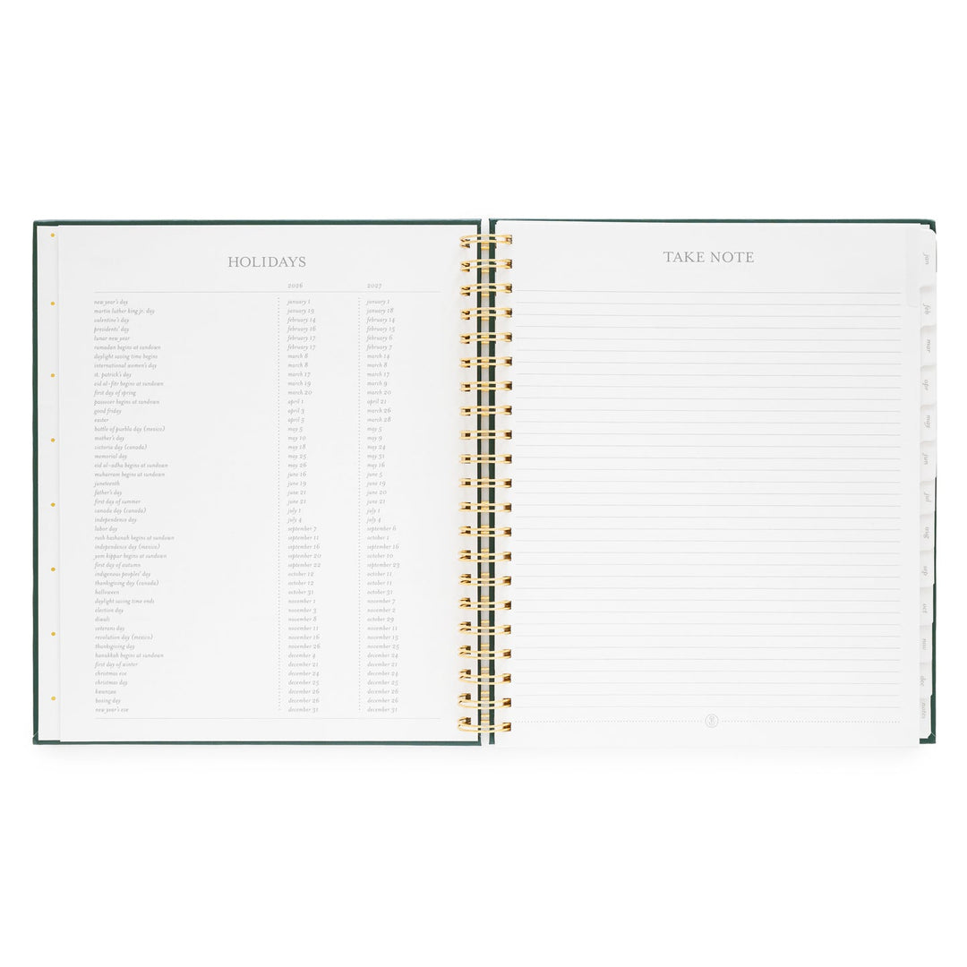 Planner opened to a page listing holidays on the left and a page for notes on the right.