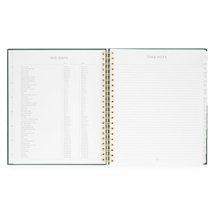 Planner opened to a page listing holidays on the left and a page for notes on the right.