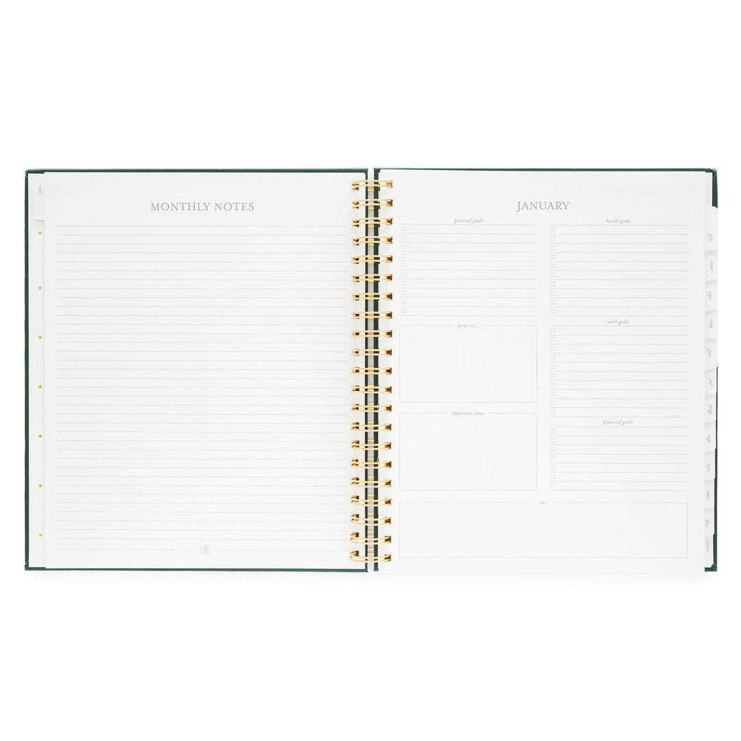 Planner opened to show a page for monthly notes on the left and a page for January goals on the right.