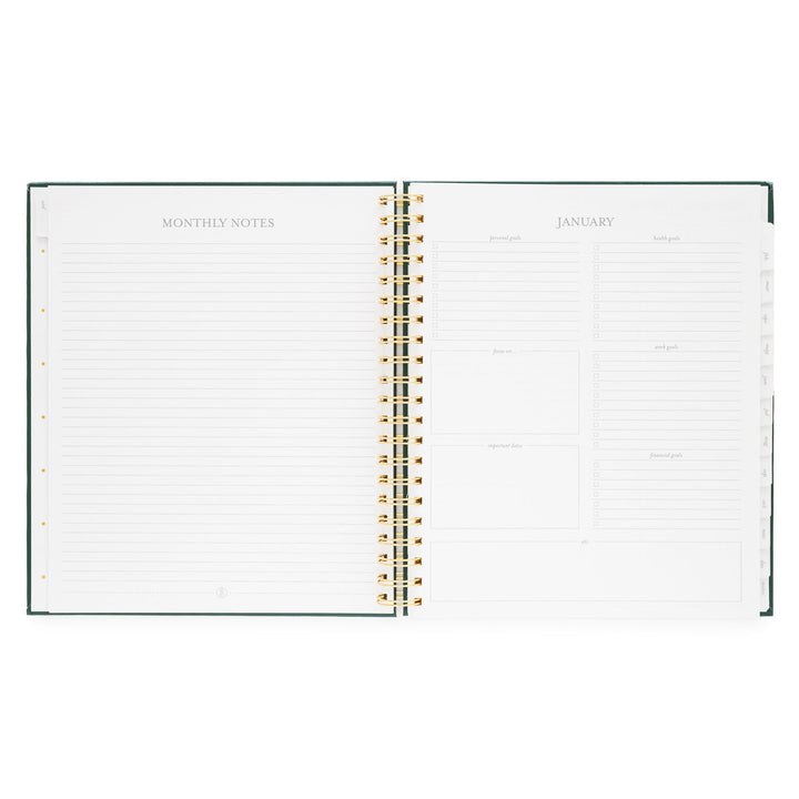 Planner opened to show a page for monthly notes on the left and a page for January goals on the right.