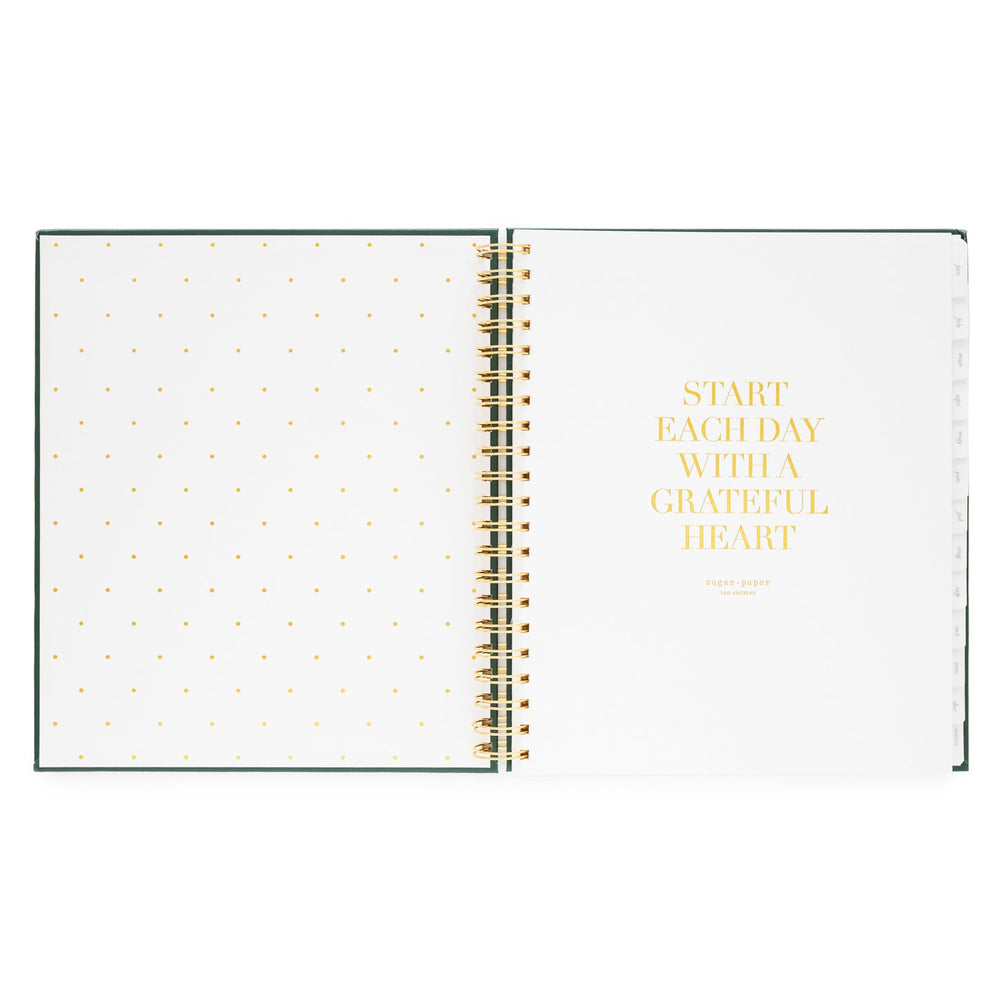 Inside cover of notebook with a dotted page on the left and a motivational quote on the right, 'Start each day with a grateful heart.'