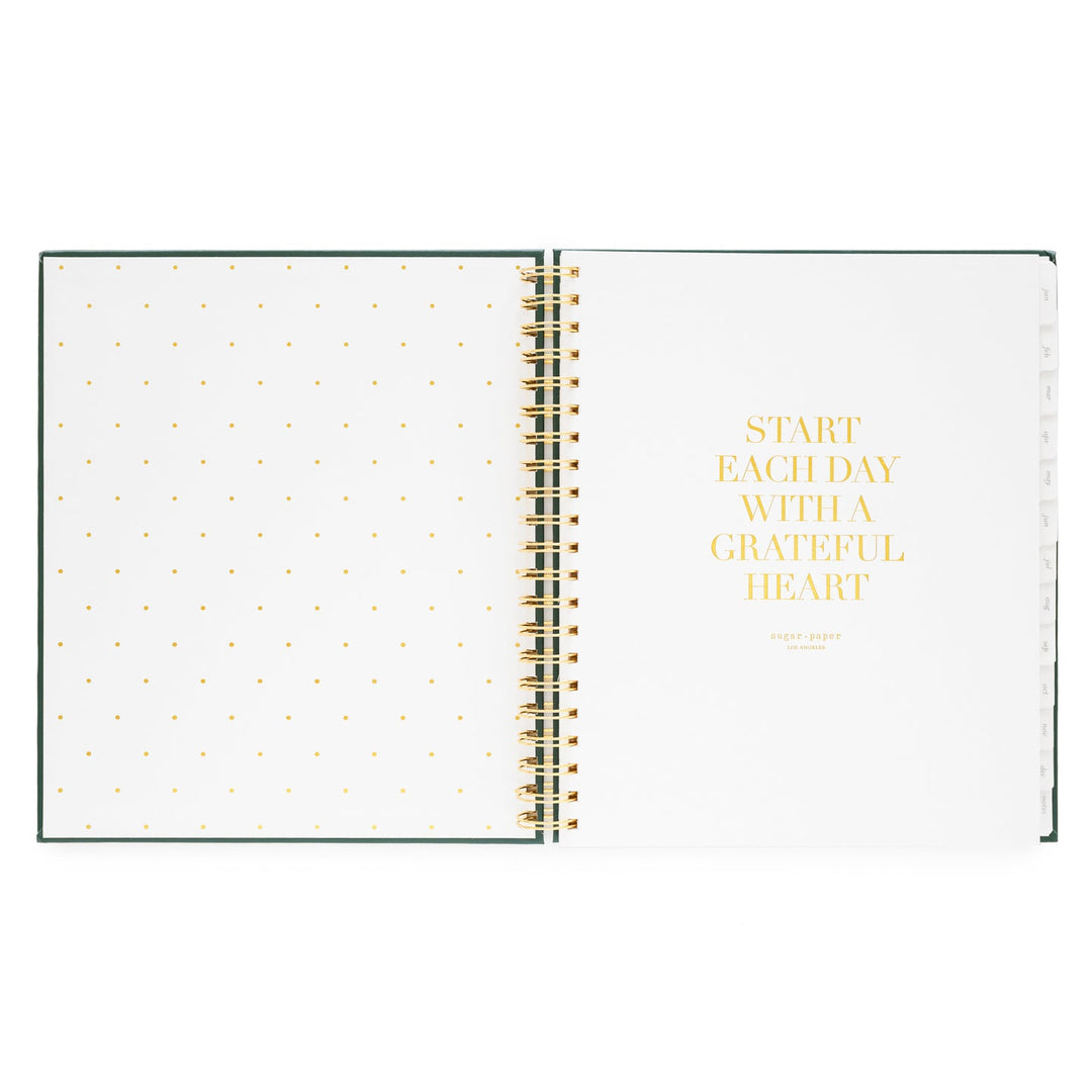 Inside cover of notebook with a dotted page on the left and a motivational quote on the right, 'Start each day with a grateful heart.'