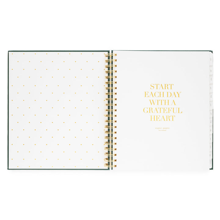Inside cover of notebook with a dotted page on the left and a motivational quote on the right, 'Start each day with a grateful heart.'