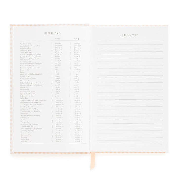 Planner opened to show a list of holidays on the left and a space for notes on the right.