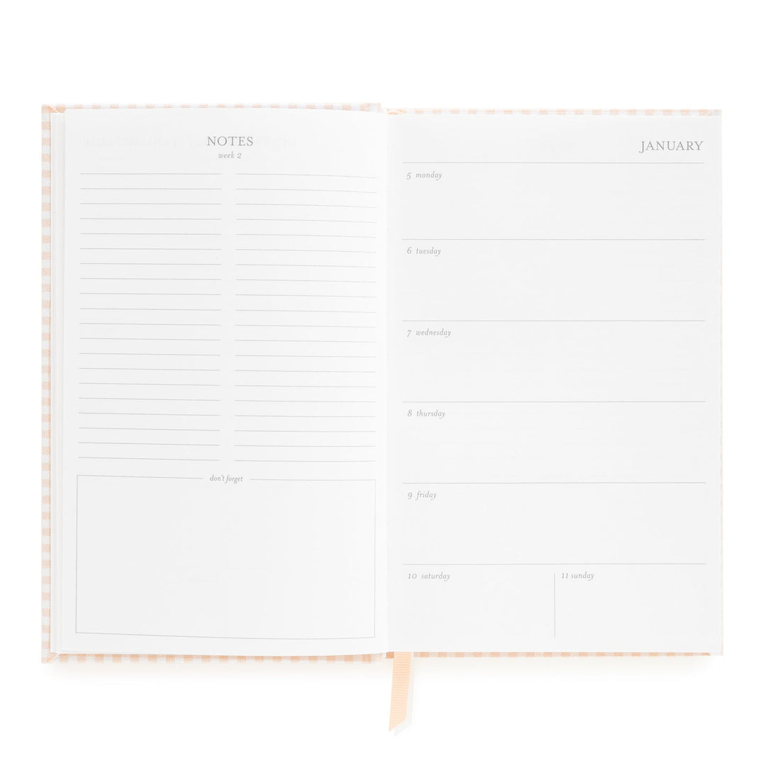 Notebook opened to show sections for notes on the left and the first week in January on the right.