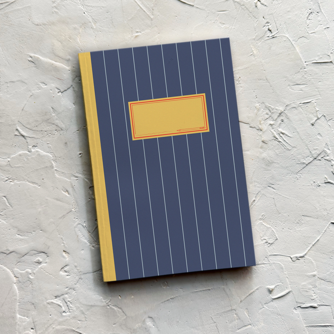 A notebook with a navy blue cover featuring thin white vertical pinstripes, a mustard yellow spine, and a blank mustard yellow label on the front.