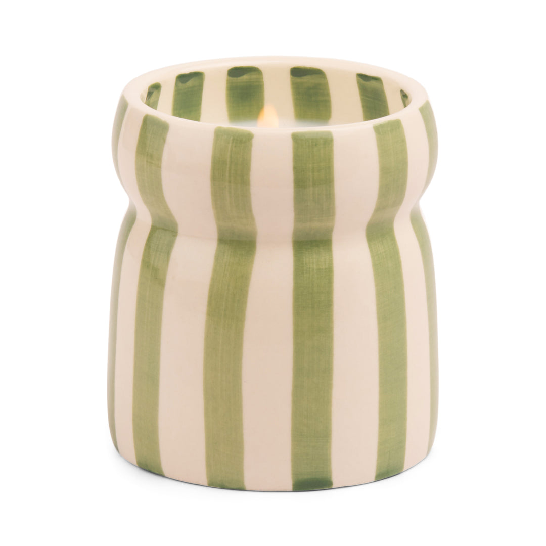 Ceramic candle holder with green and off white vertical stripes.
