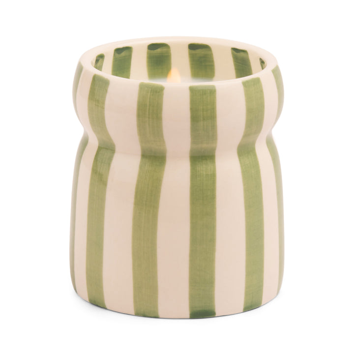 Ceramic candle holder with green and off white vertical stripes.