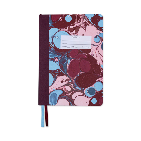 Cover of notebook with burgundy and blue  marbled cover with white label for identifying contents.
