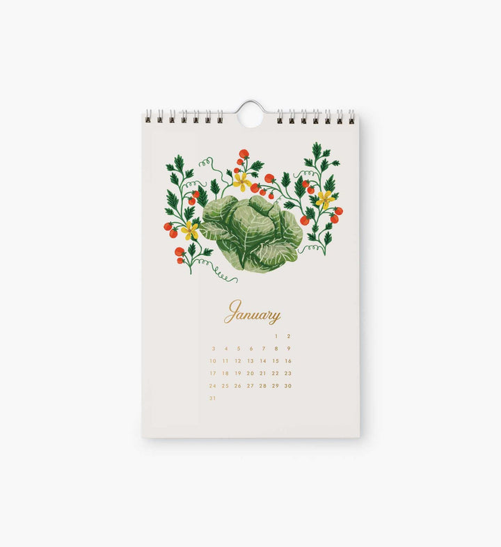 The calendar page for January with an illustration of cabbage  surrounded by a vine with red berries.