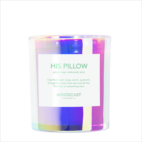 A Moodcast 'His Pillow' scented candle in a clear glass jar with a white label, showing vibrant purple, pink, and blue iridescent wax inside.