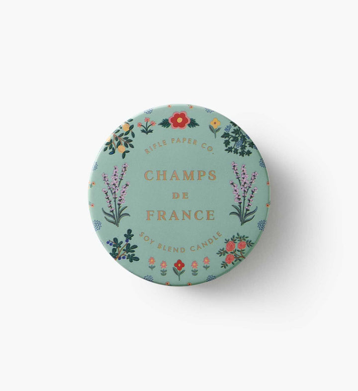 Top of tin with lavender and other flowers and the name printed in the center.
