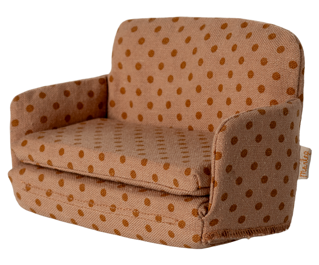 Stuffed sofa with brown polka dot pattern