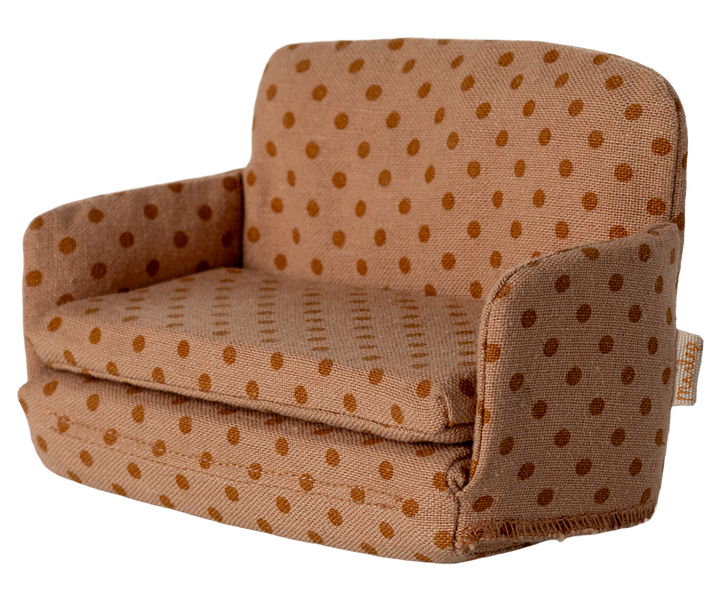 Stuffed sofa with brown polka dot pattern