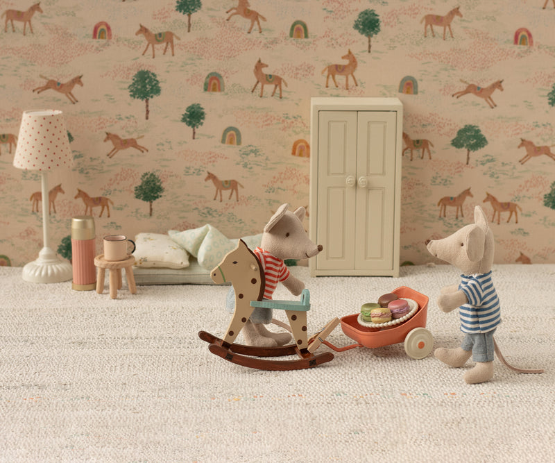 Floor lamp in a mouse bedroom with wo mice playing.