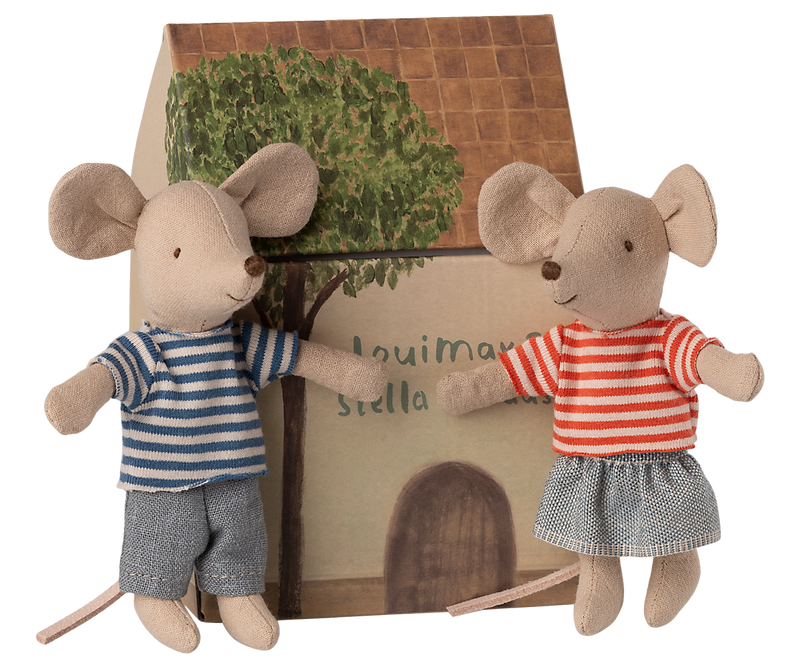 LouiMax and Stella outside their cardboard house.